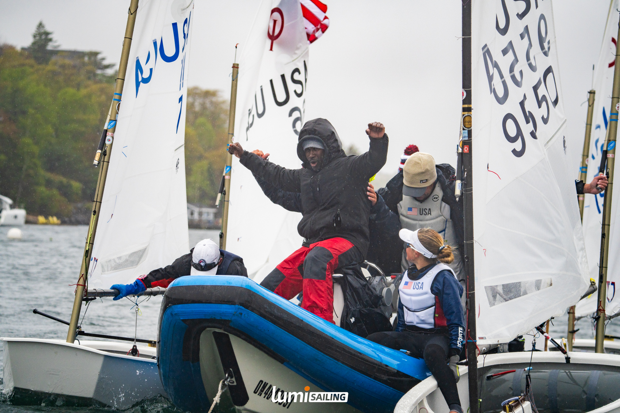 Support boat alongside Optimist sailors after racing